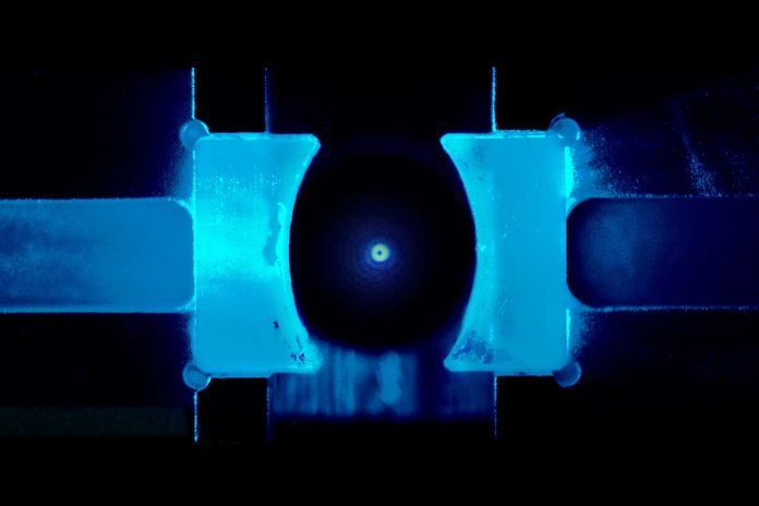 HamaraTimes.com | This tiny glass bead has been quantum chilled to near absolute zero